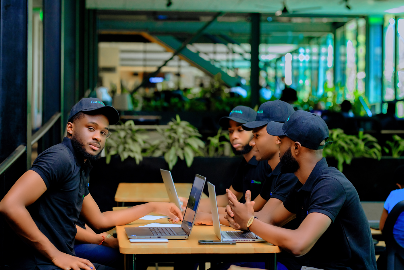 IkoRwanda team members working side by side at laptops
