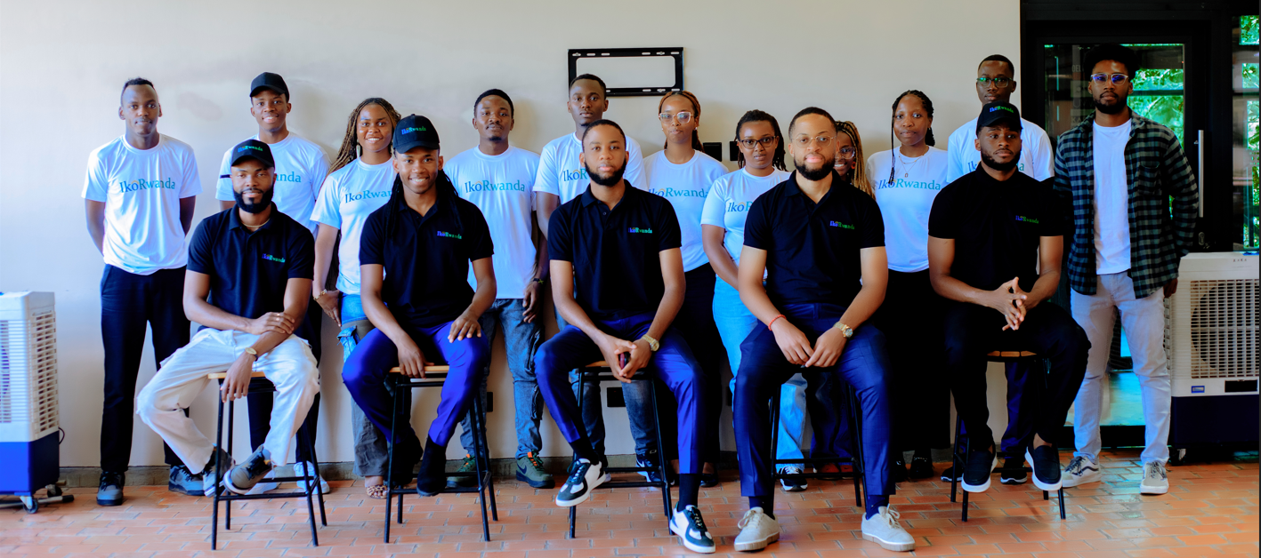 IkoRwanda full team photo — branded white and navy shirts
